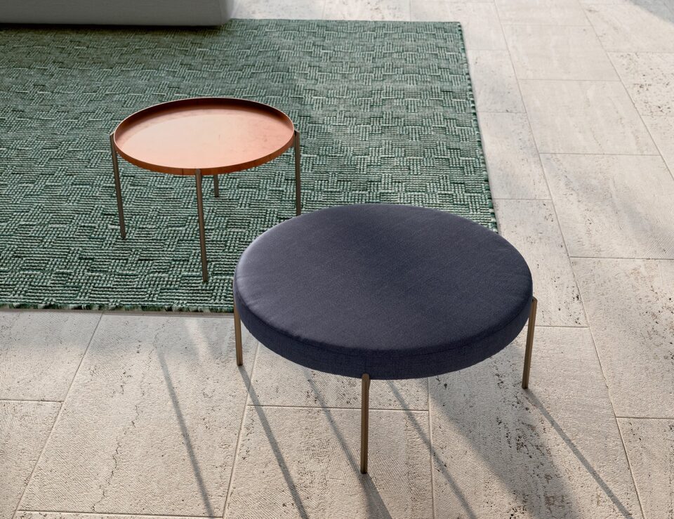 Metal Apollo coffee tables with round tops in outdoor setting