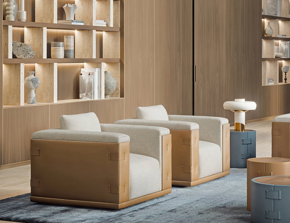 Leather and fabric swivel sofa chairs in a living room setting