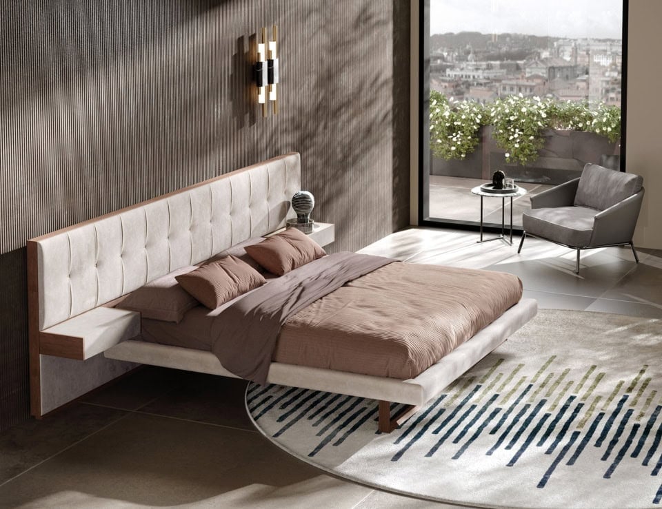 Leather upholstered bed with extended headboard in bedroom setting