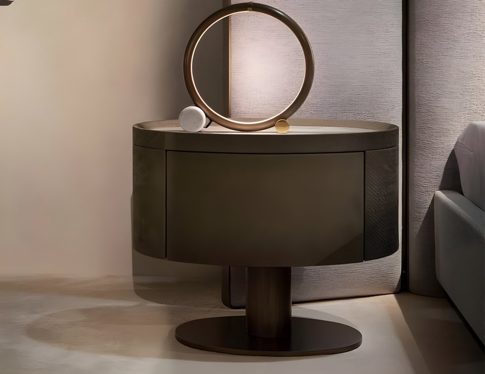 Metal bedside table with round base and storage drawer