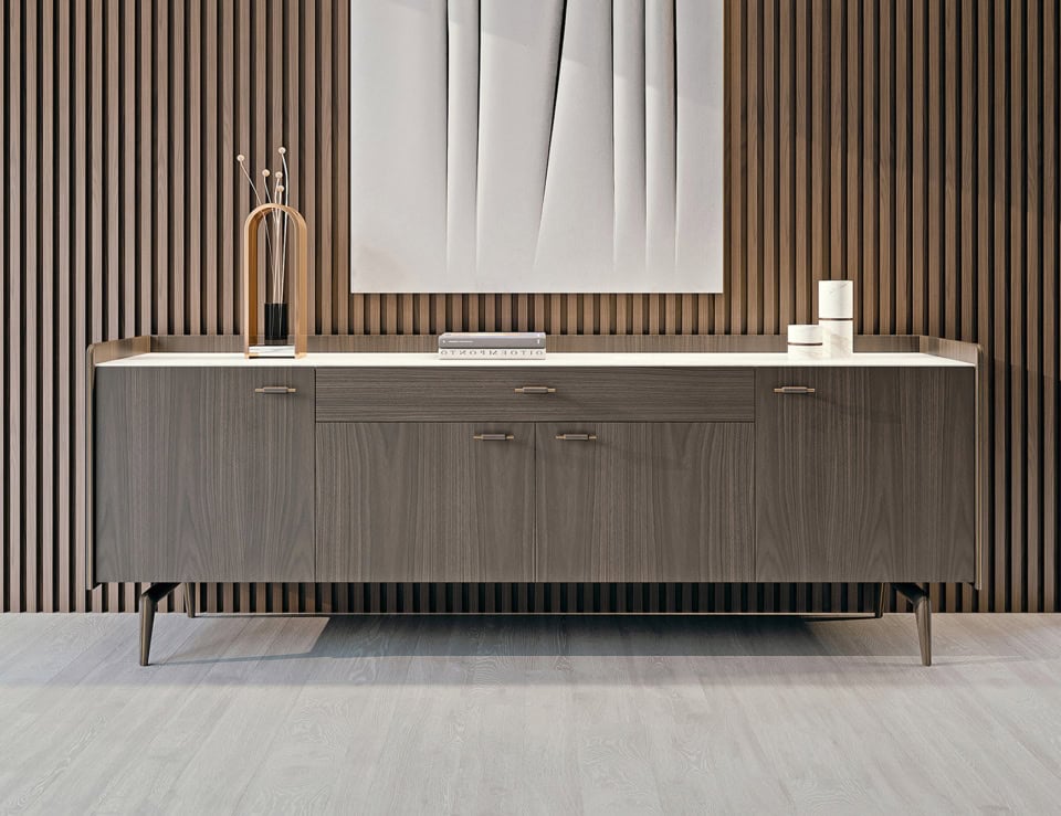 Walnut wood sideboard credenza with drawers and cabinet doors in dining setting