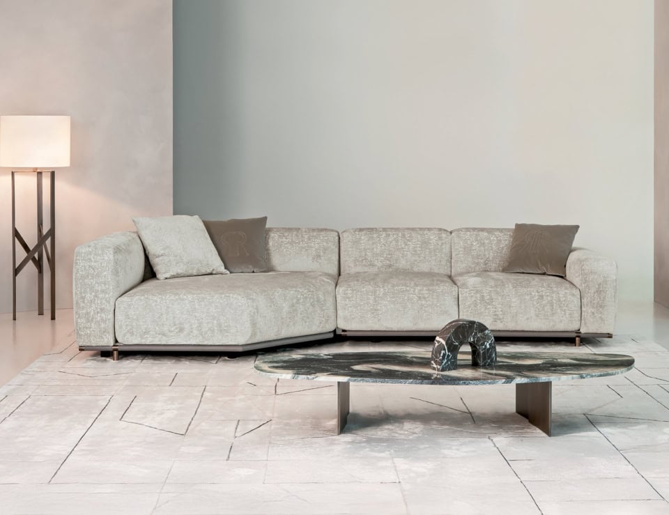 Boheme upholstered fabric sectional sofa with cushions in a living room setting