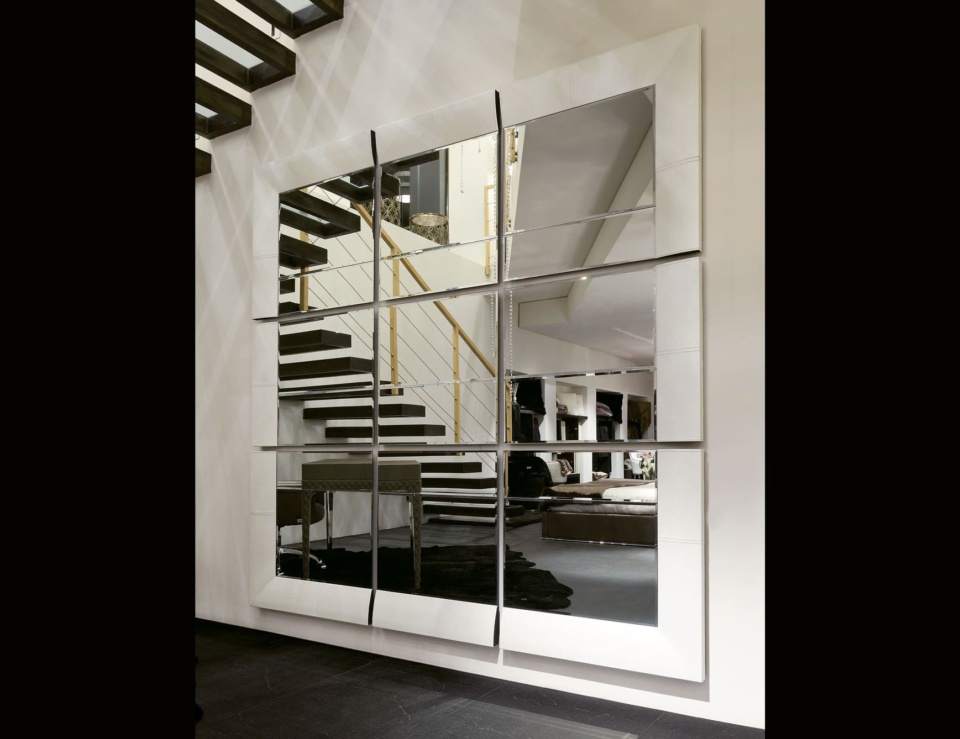 Large wall mirror with leather frame and mirrored glass panels