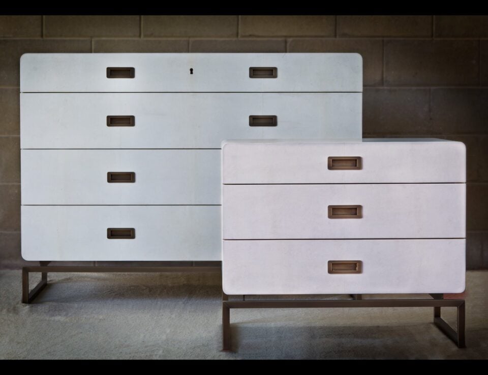 Leather and wood chest of drawers on metal base