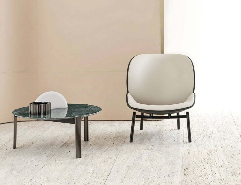 Leather lounge chair with black frame in living room setting