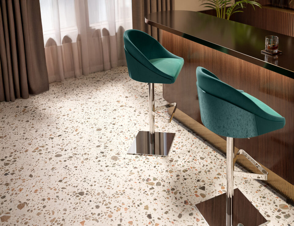 Upholstered fabric shell stools with metal bases beside a bar counter