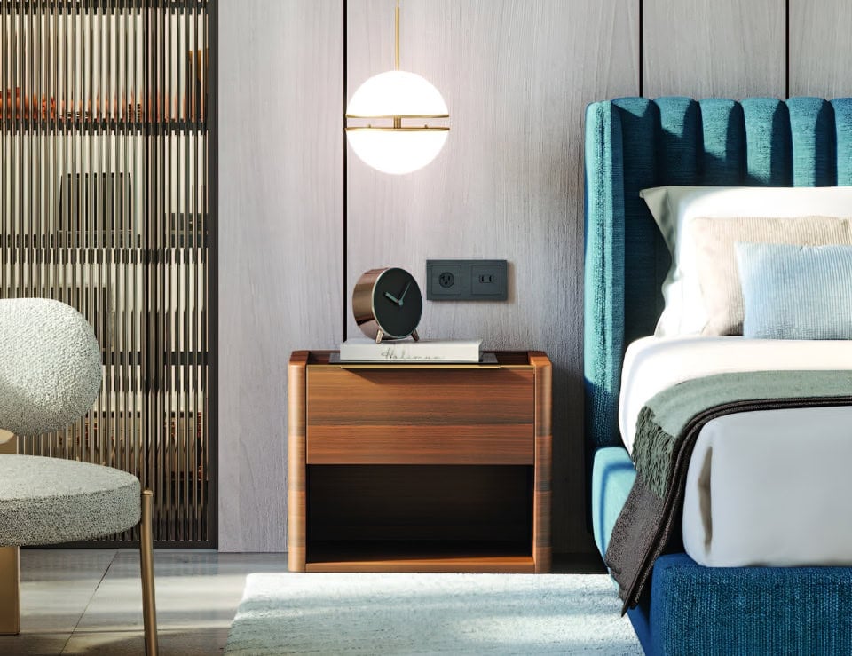 Wood bedside table with eucalyptus finish beside bed