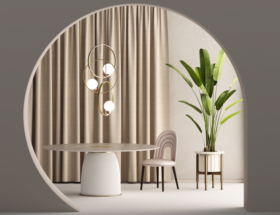 Fabric dining chair with curved backrest beside round dining table in neutral room setting