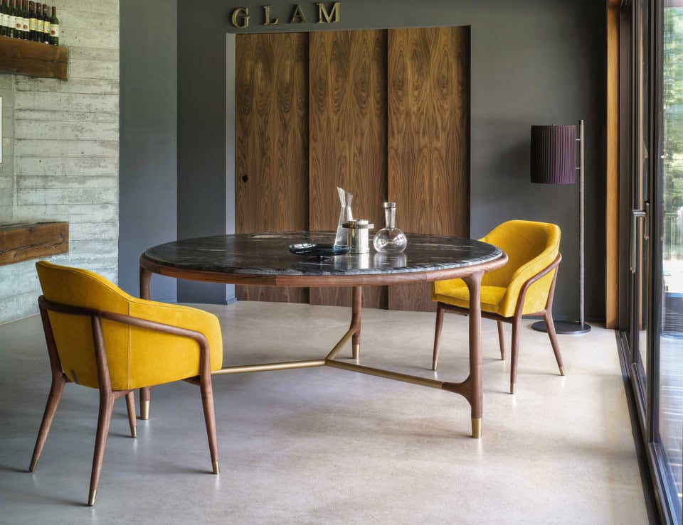 Round marble dining table with Nero Marquina finish and wooden base