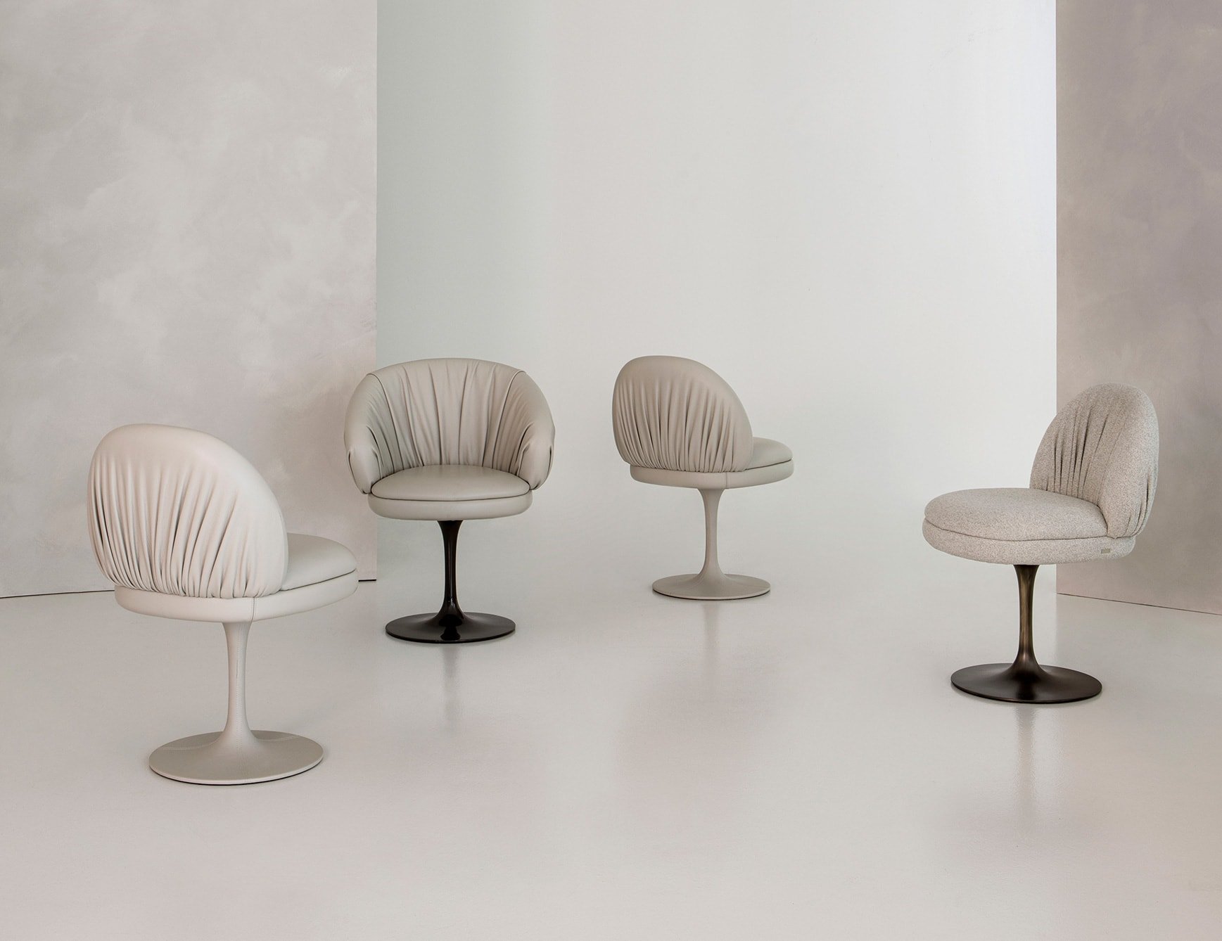 Fandango - Leather dining chairs with round swivel bases in neutral tones