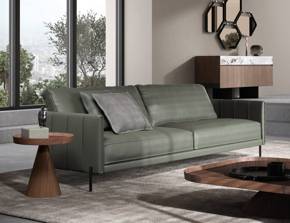 Leather sofa with straight arms and metal legs in living room setting