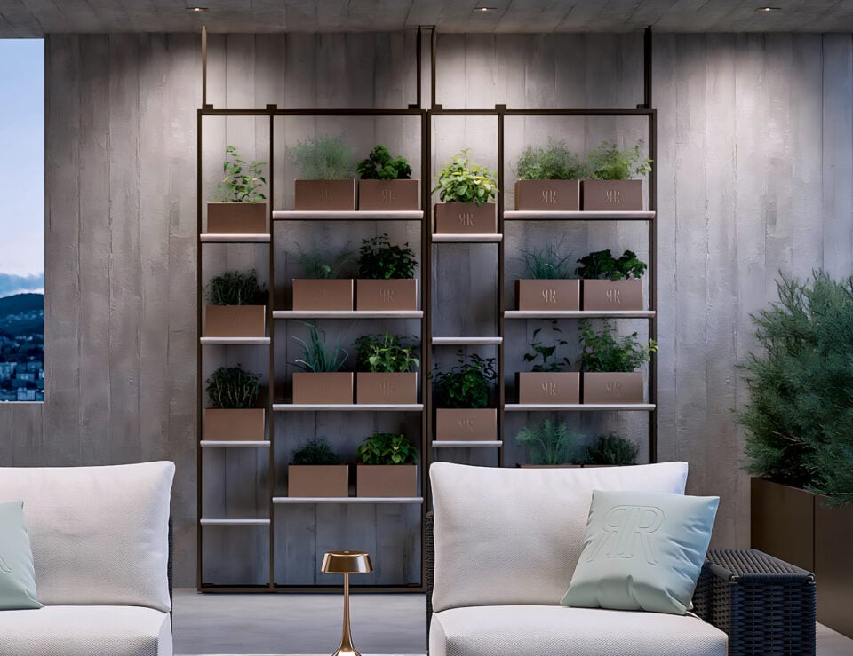 Metal outdoor bookcase with multiple shelves holding planters