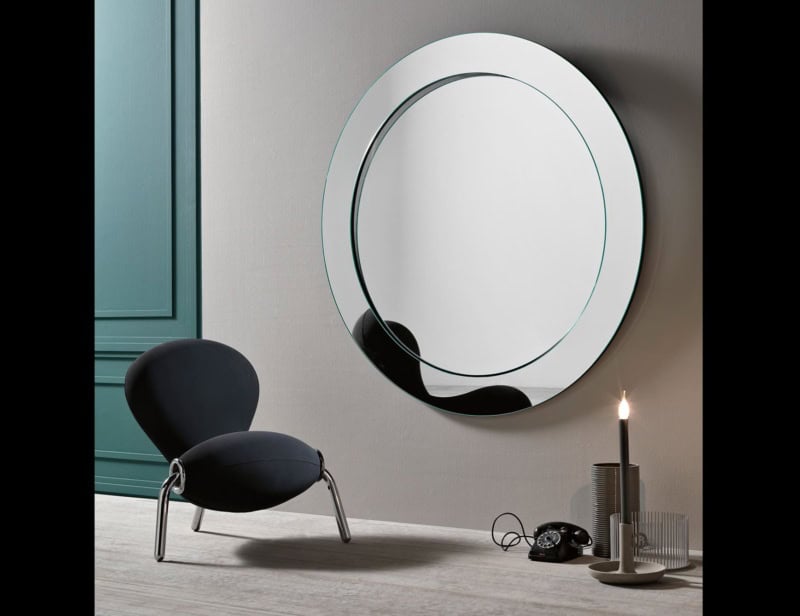 Round wall mirror with glass frame and reflective finish