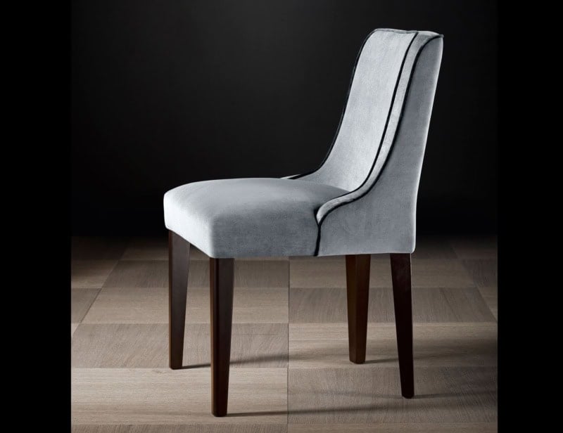 Upholstered dining chair with wooden legs and fabric seat