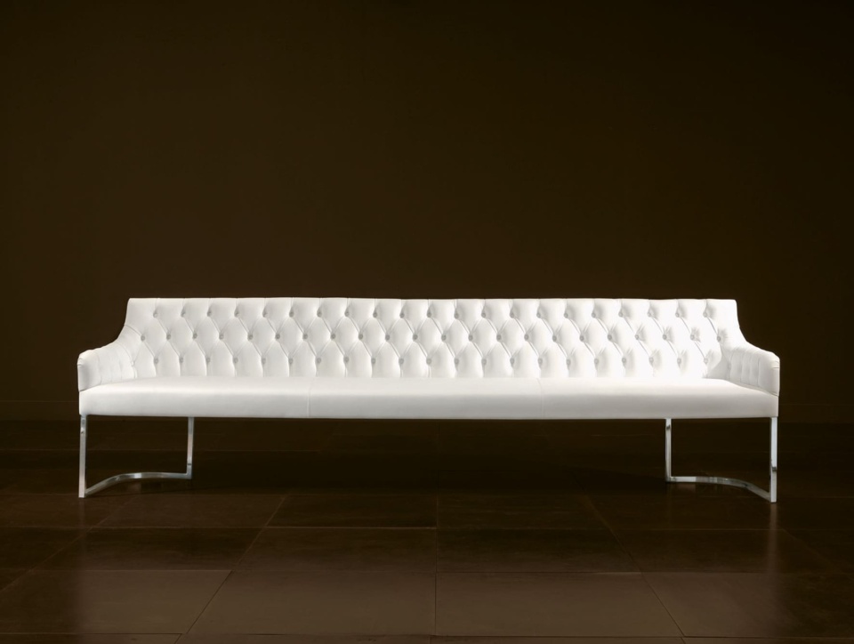 White tufted leather banquette with metal legs for dining room seating