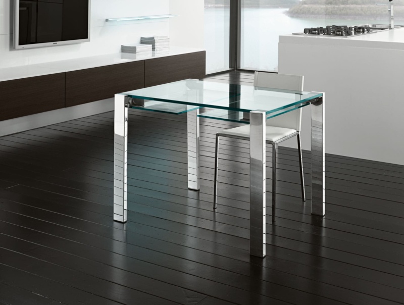 Glass dining table with chrome metal legs and chair