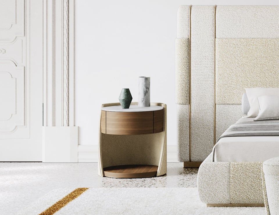 Leather bedside table with wood accents beside upholstered bed