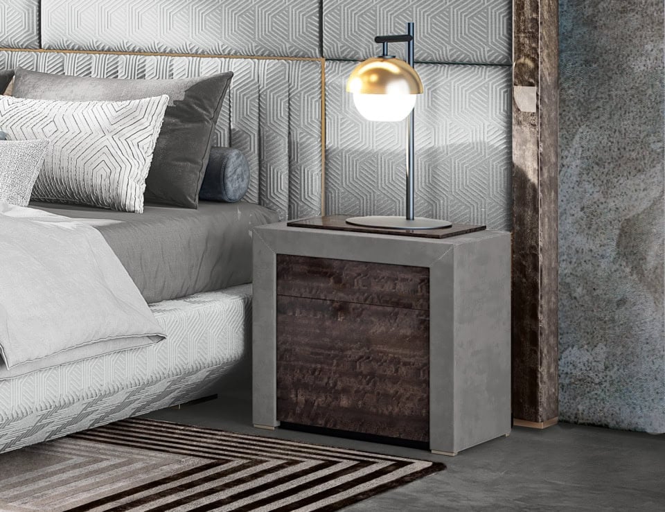 Leather bedside table with rectangular shape and two drawers beside a bed