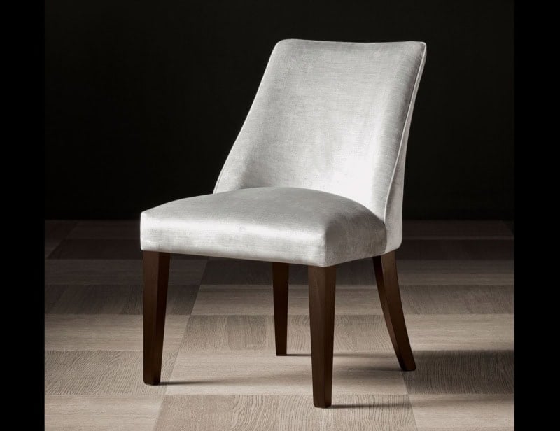 Upholstered dining chair with wooden legs and fabric seat