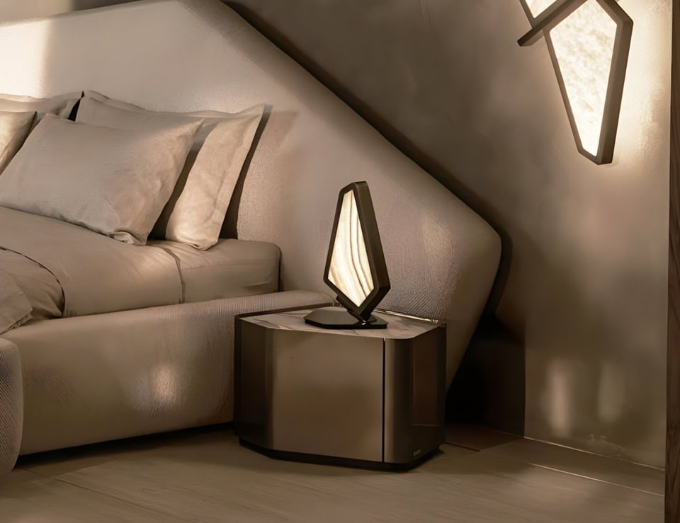 Neolito marble bedside table with Carrara finish beside bed