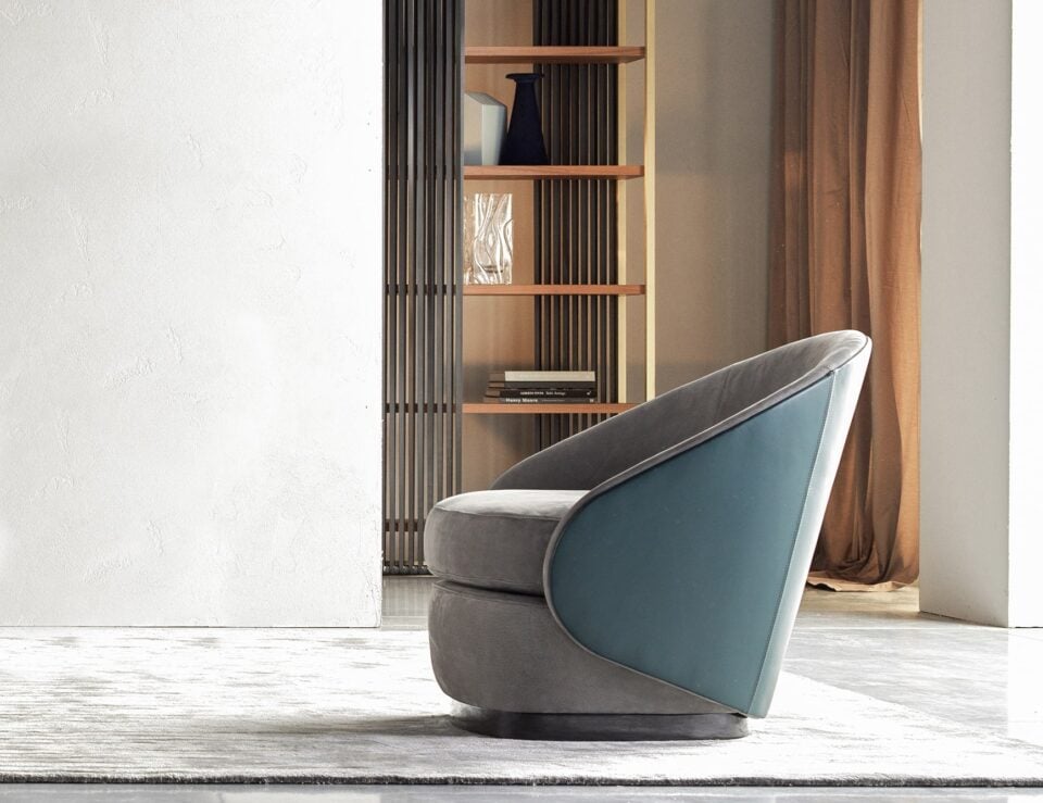 Leather swivel armchair with curved backrest in living room setting