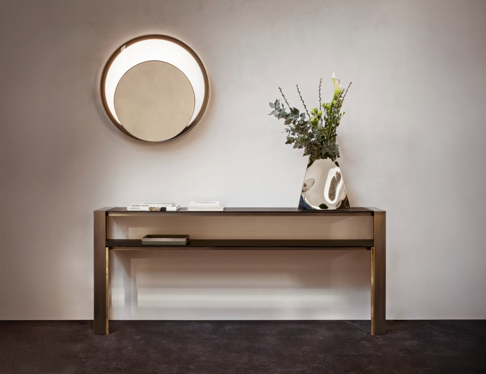 Metal console table with rectangular top and open shelf in living room setting
