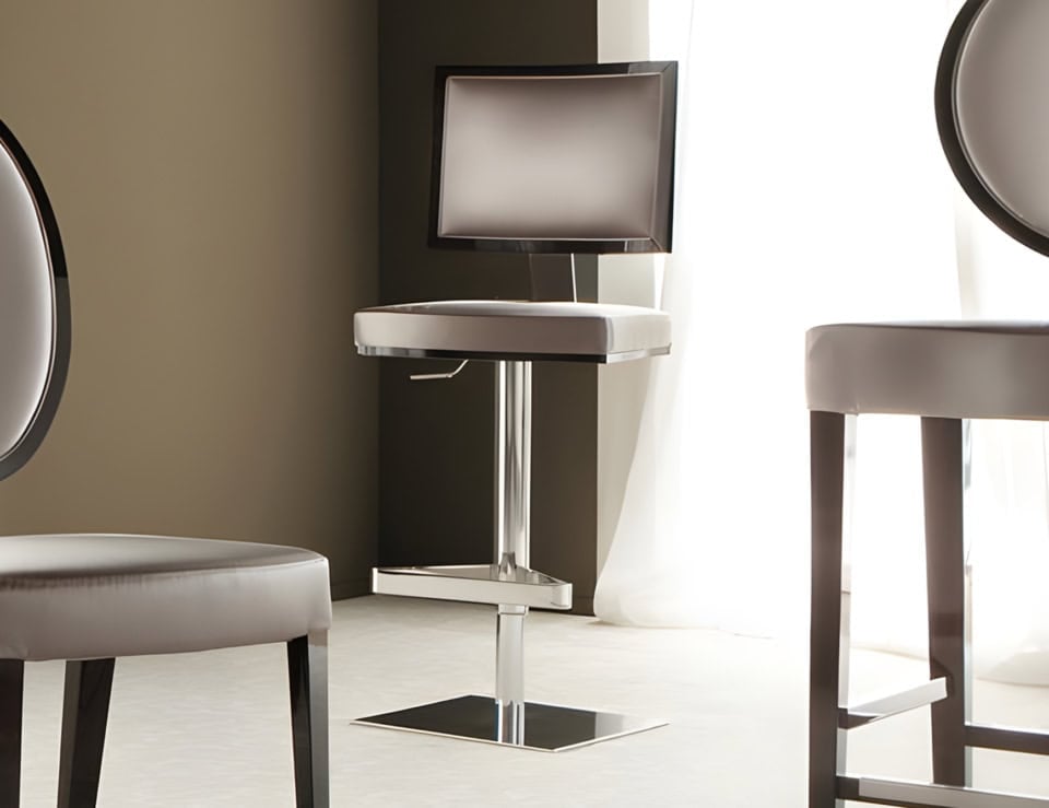 Leather and metal stool with square base in indoor setting