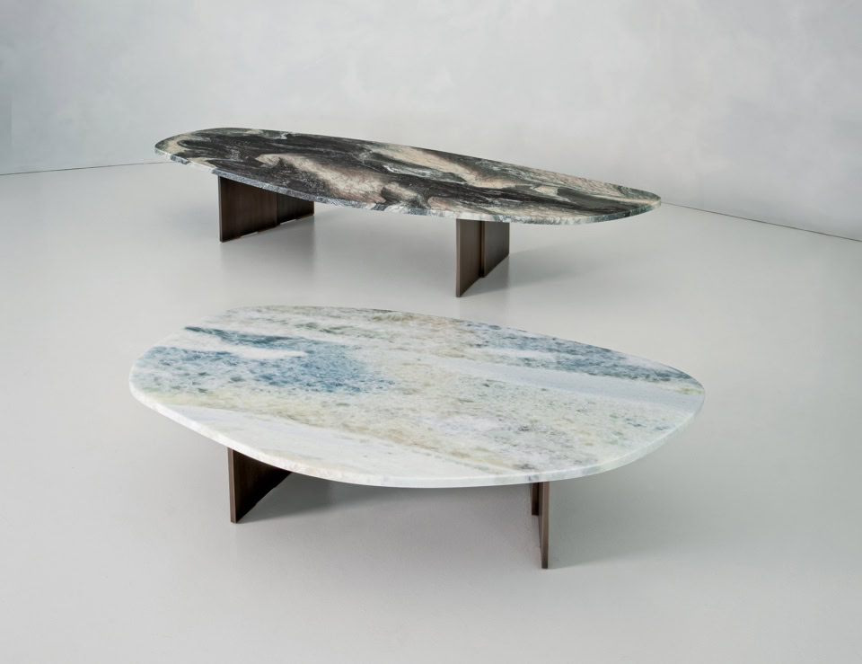 Oval marble coffee tables with Calacatta Oro finish and wood bases