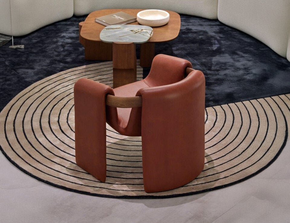 Leather armchair with curved wooden frame in a dining room setting