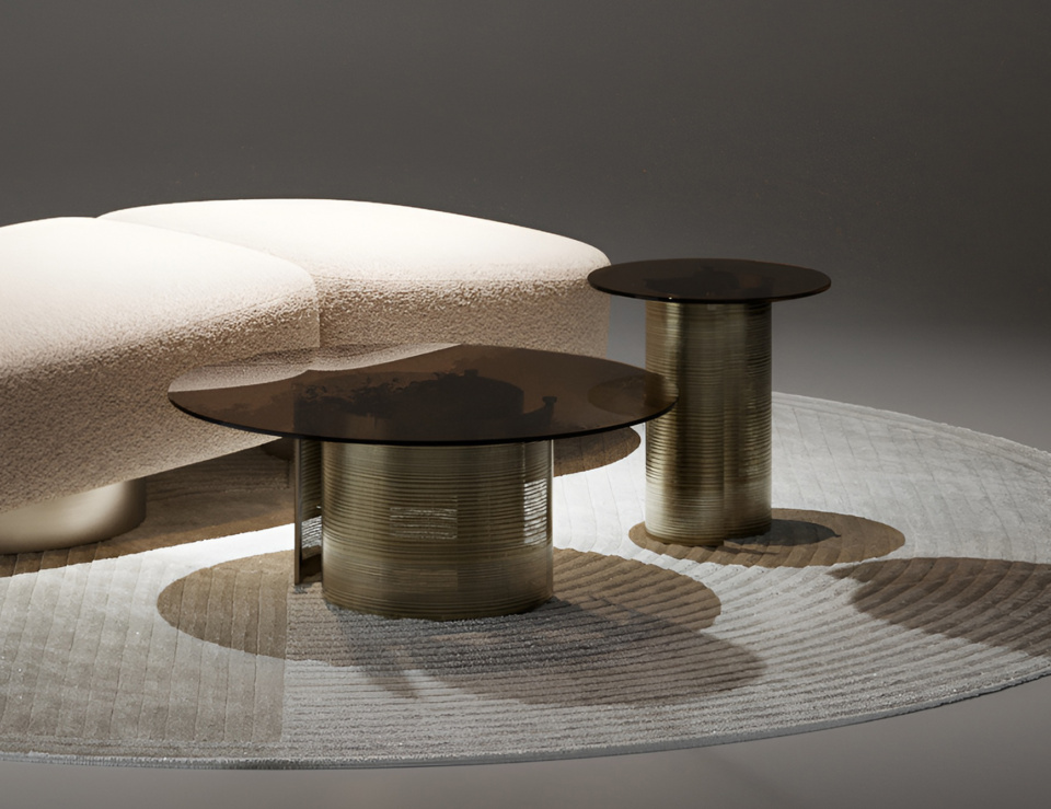 Metal coffee table with round base and dark top