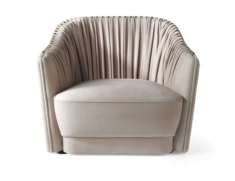 Beige upholstered armchair with pleated fabric backrest