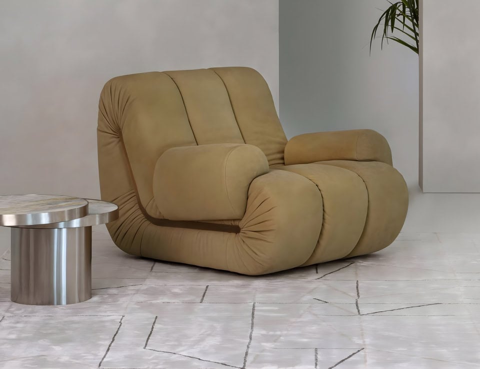 Fabric swivel armchair with curved cushioned design in living room setting