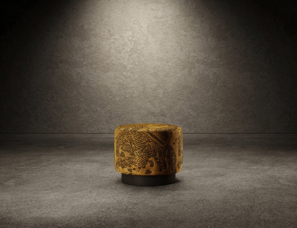 Round leather and wood pouf with engraved pattern on floor background
