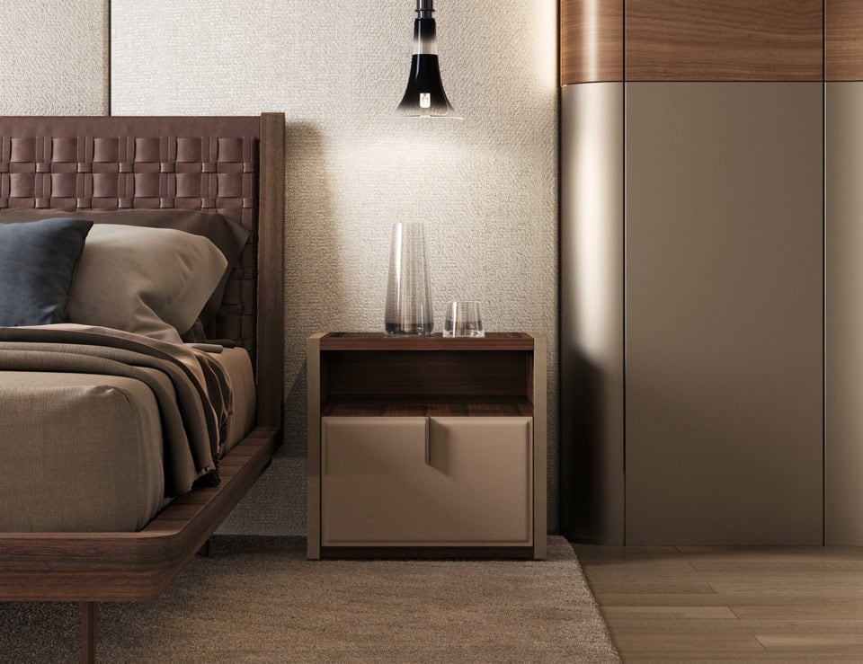 Wood bedside table with walnut finish beside bed