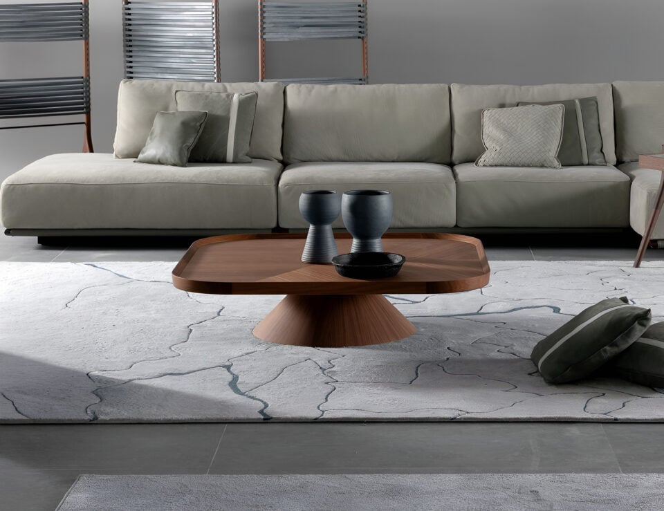 Wood coffee table in American walnut finish shown in living room setting