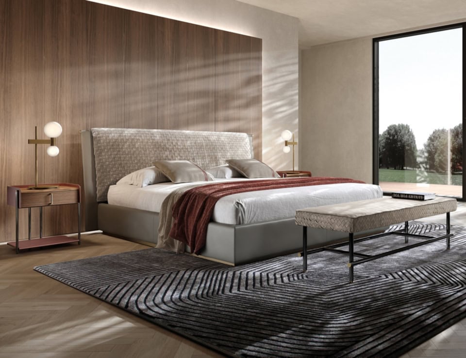 Leather storage bed with upholstered headboard in bedroom setting