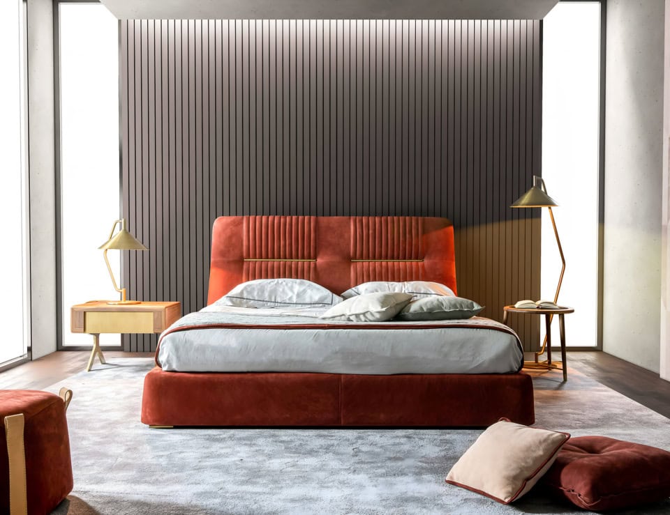 Leather storage bed with upholstered headboard in bedroom setting