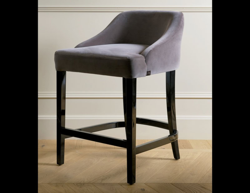 Upholstered bar stool with fabric seat and wooden legs
