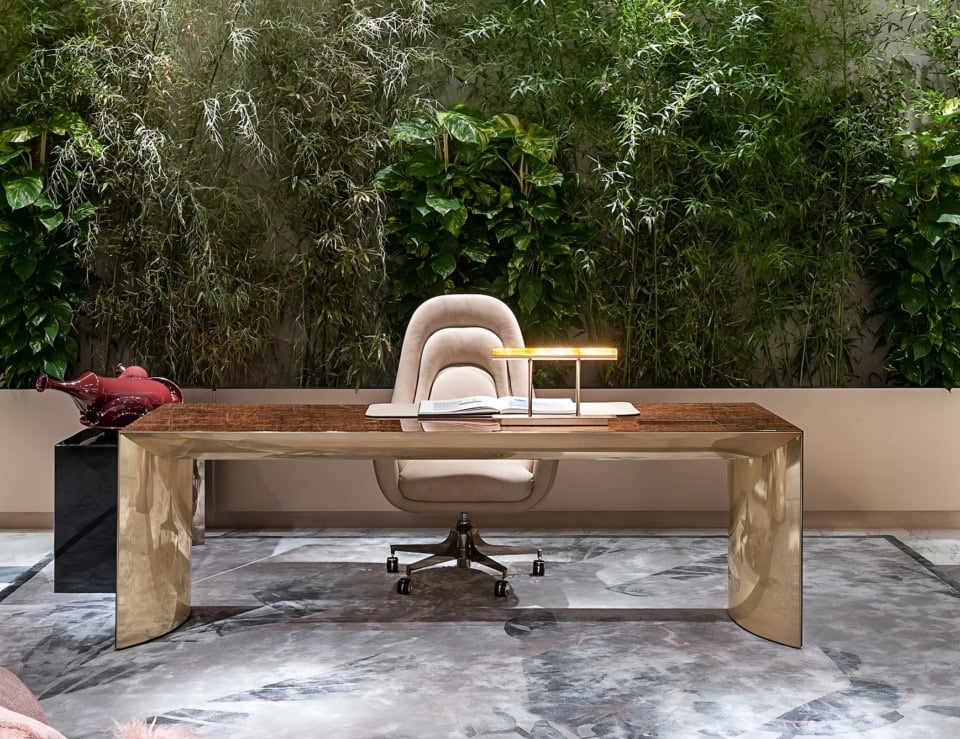 Metal office desk with polished finish and rectangular top in indoor setting