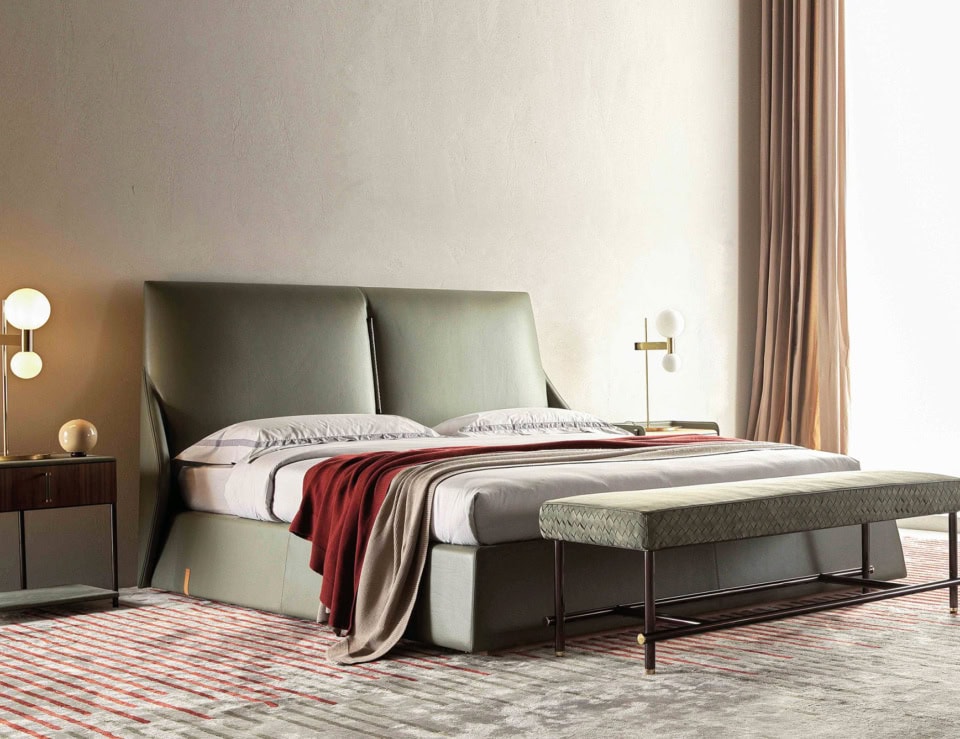 Leather storage bed with padded headboard in bedroom setting