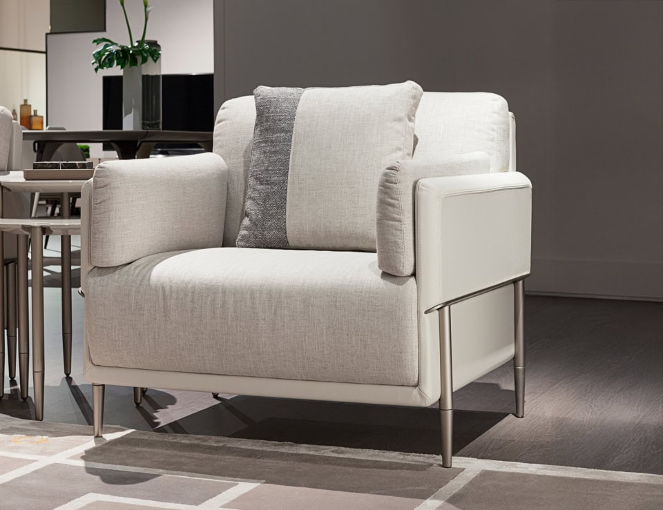 Leather sofa chair with metal legs in living room setting